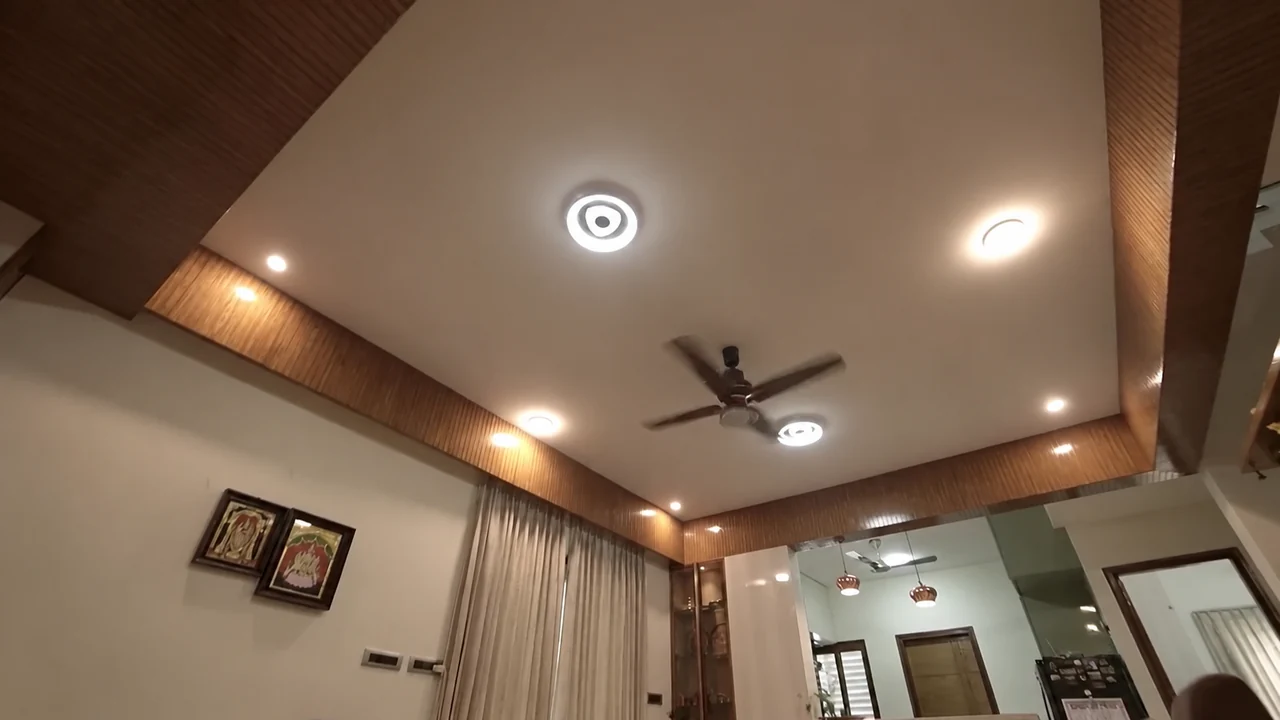 Layered ceiling lighting with warm timber edging