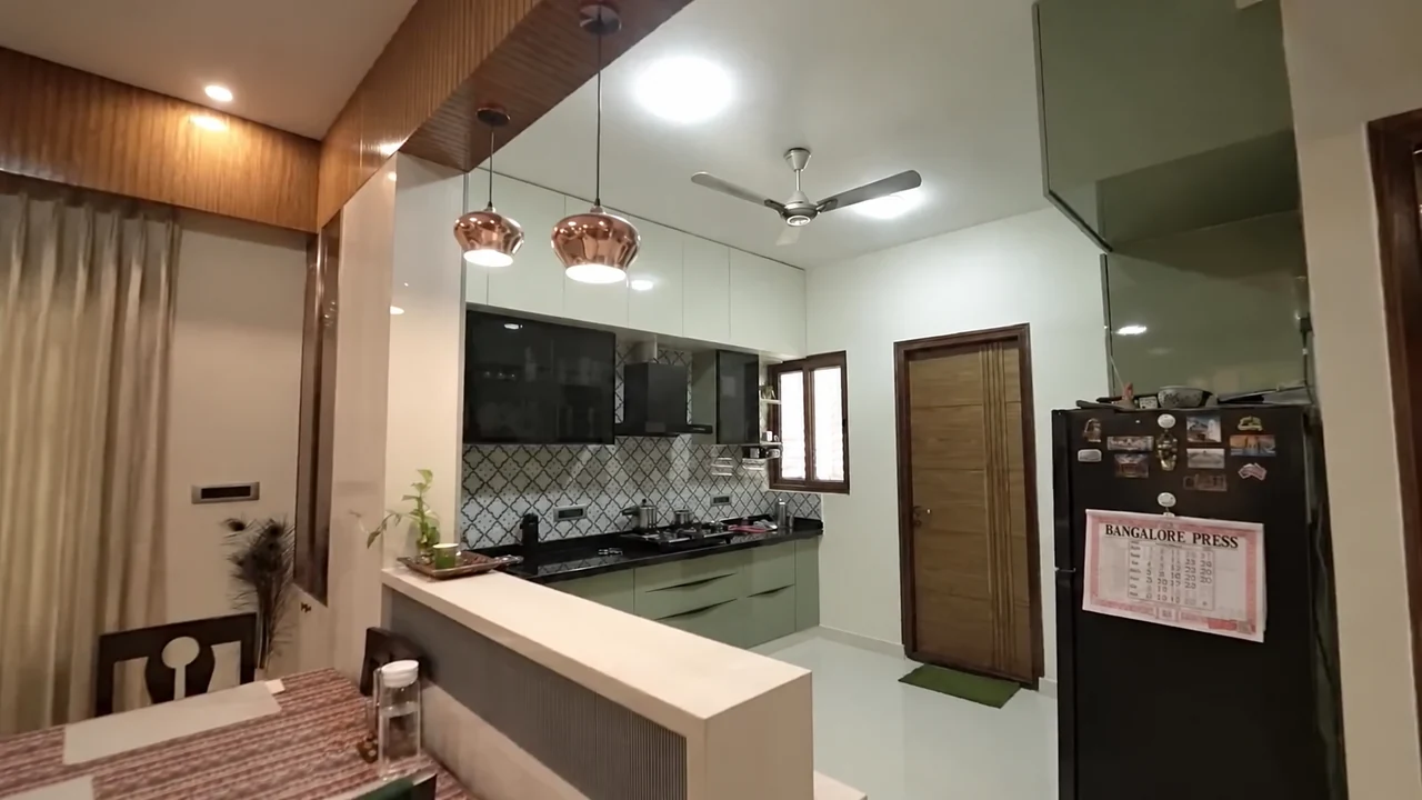 A wider kitchen and dining view with a breakfast counter